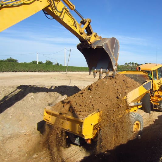 Heavy Excavator Loading a Truck